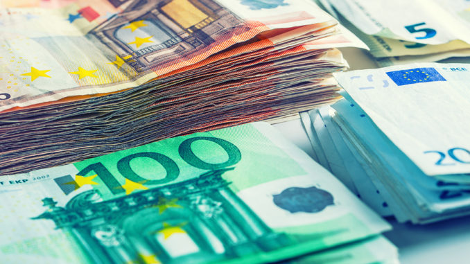 Several hundred euro banknotes stacked by value.